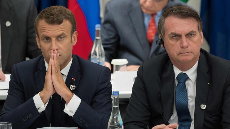 Macron, fotografado ao lado de Bolsonaro na reunião do G20, no Japão - JACQUES WITT/AFP