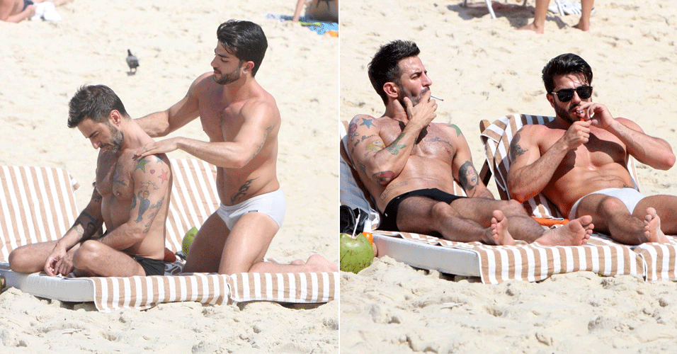 Marc Jacobs ganha massagem do namorado em praia do Rio