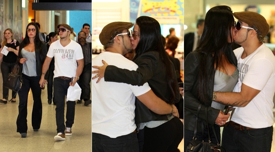 Belo e Gracyanne Barbosa trocam beijos no aeroporto Santos Dumont, centro do Rio (9/5/12)