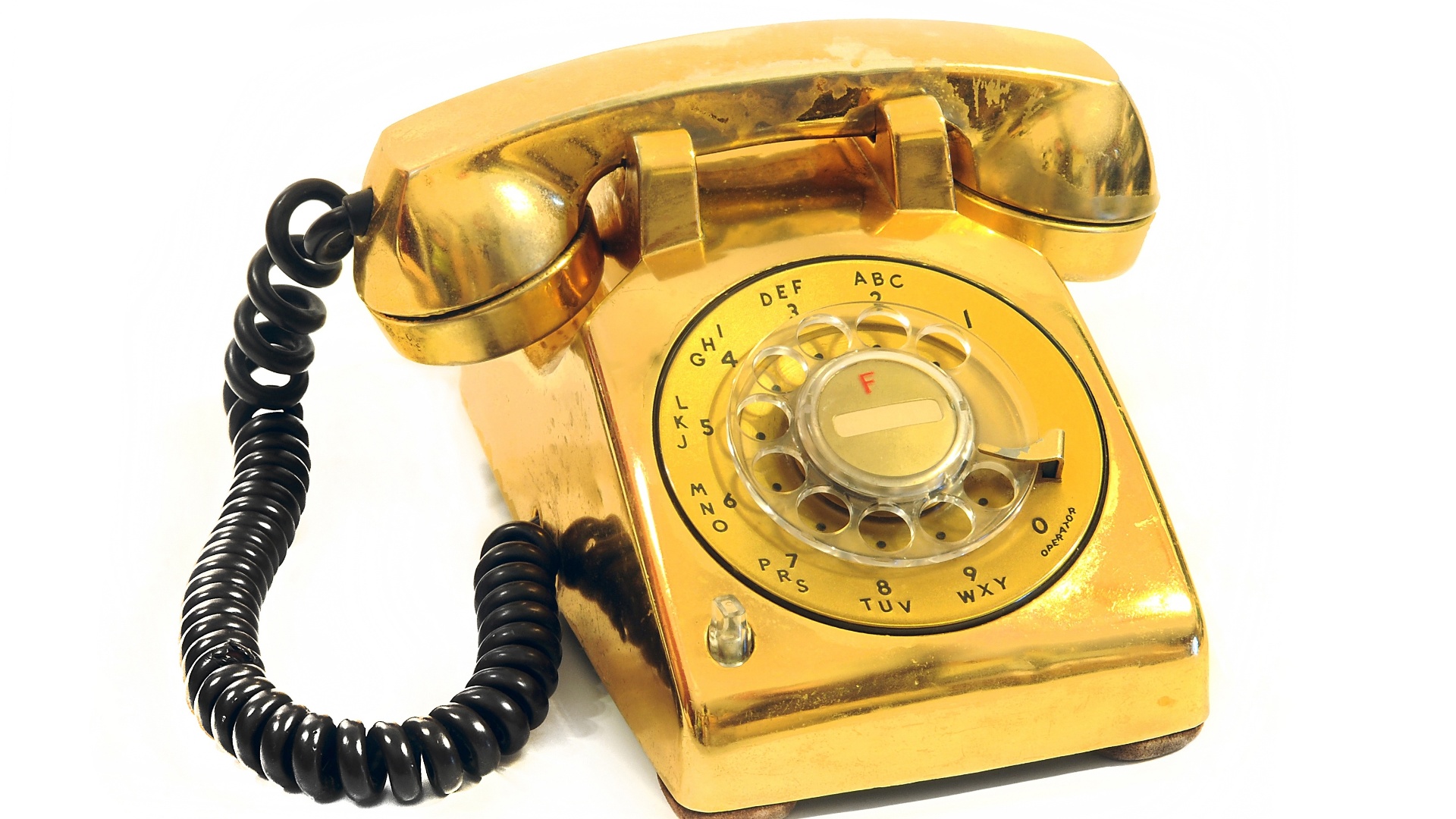 Item da exposição "The Elvis Experience", que chega ao Brasil em setembro de 2012: o telefone folheado a ouro do quarto de dormir de Elvis - Divulgação