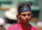 Nadal mostra bom humor e diz não saber a cor de sua camiseta em Roland Garros - AFP PHOTO / KENZO TRIBOUILLARD