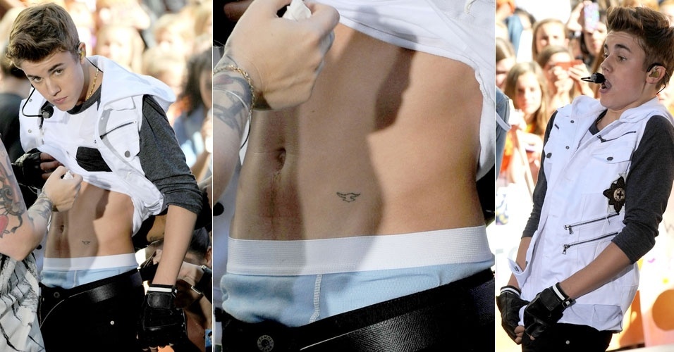 Ao levantar a camiseta para colocar microfone, ao participar do programa "Today", do canal NBC, no Rockefeller Center, em Nova York, Justin Bieber deixa à mostra sua tatuagem na barriga (15/6/12) 