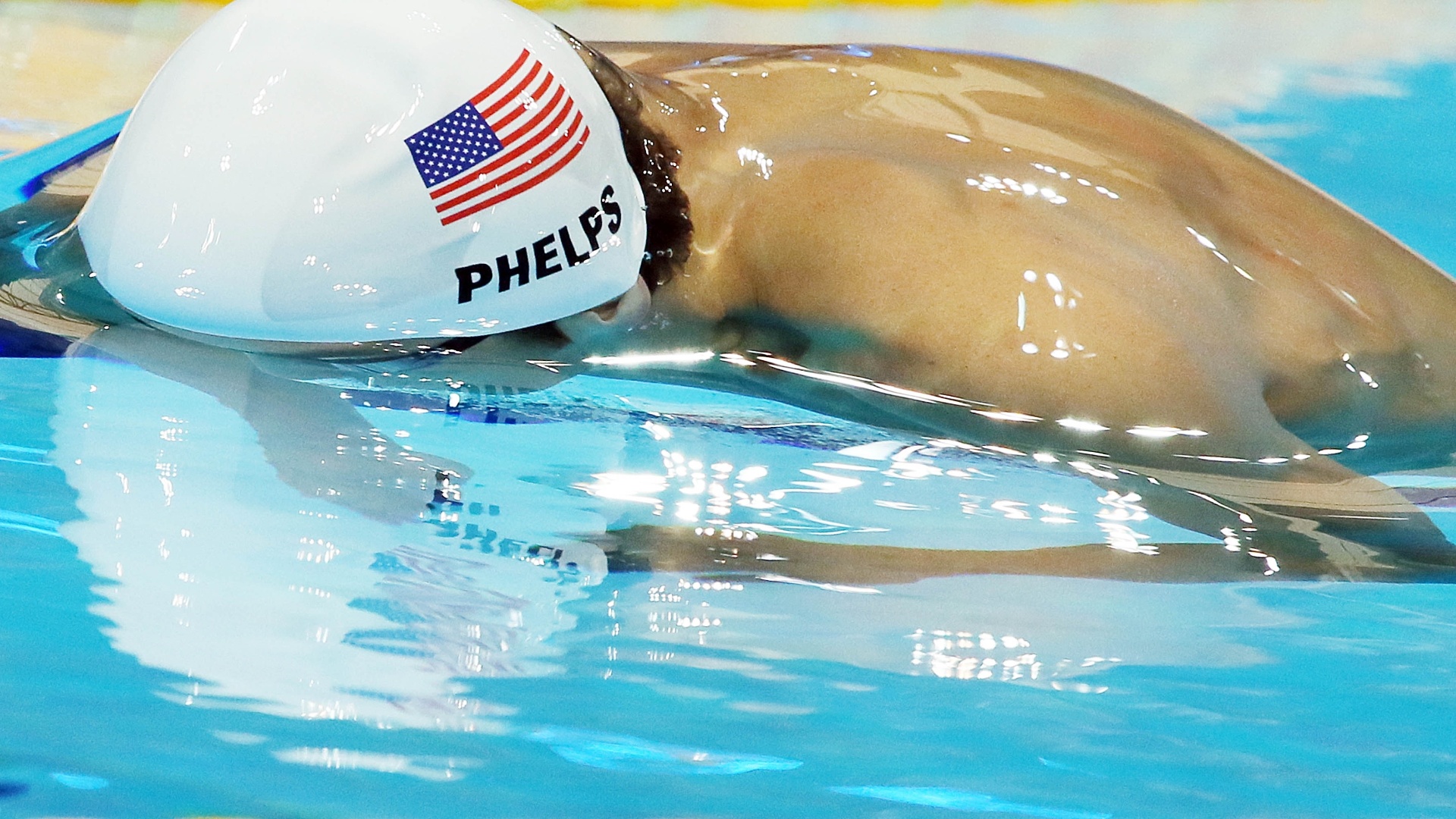 Michael Phelps liderou sua bateria na eliminatória dos 100 m borboleta