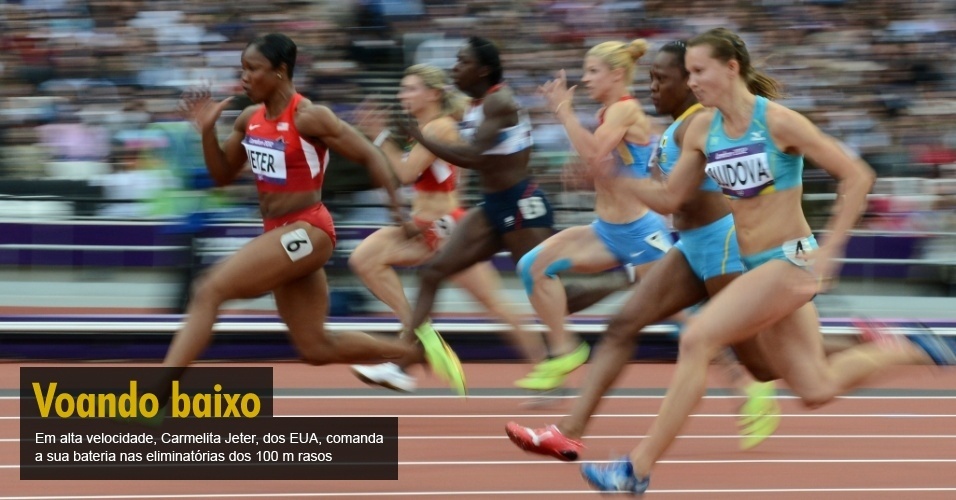 Em alta velocidade, Carmelita Jeter, dos EUA, comanda a sua bateria nas eliminatórias dos 100 m rasos 
