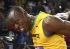 Homem é preso após jogar garrafa plástica em Usain Bolt durante prova dos 100 m rasos - AFP PHOTO / ADRIAN DENNIS