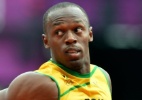 Bolt sobra, vence bateria e segue na briga pelo bi dos 200 m; dois brasileiros avançam - AFP PHOTO / JEWEL SAMAD