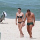 De biquíni tomara que caia, Deborah Secco curtiu praia na Barra da Tijuca, zona oeste do Rio (17/8/12). A atriz estava acompanhada do marido, o jogador de futebol Roger Flores - AgNews