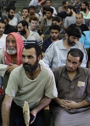 Em agosto de 2012, dezenas de sírios foram liberados na Síria, após anistia geral aos acusados de cometer delitos durante os confrontos entre opositores do regime e o Exército - Louai Beshara/AFP