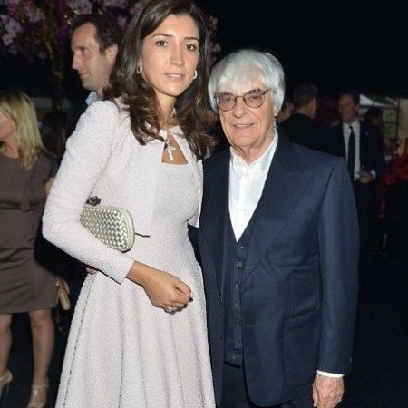 Brasileira Fabiana Flosi ao lado de seu marido Bernie Ecclestone, chefe da Fórmula 1 - Reprodução