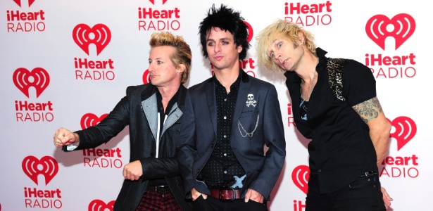Baterista Tre Cool (esq.), vocalista Billie Joe Armstrong (ao centro) e o baixista Mike Dirnt (dir.) do Green Day, em Las Vegas (21/9/12) - Steven Lawton/Getty Images
