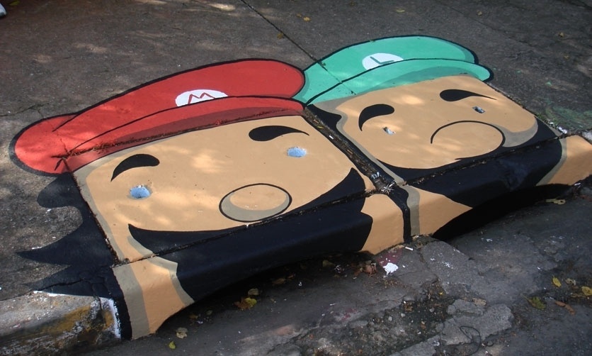 Mario e Luigi em boca de lobo pintada pelo coletivo 6eMeia, no bairro da Barra Funda, em São Paulo - Divulgação