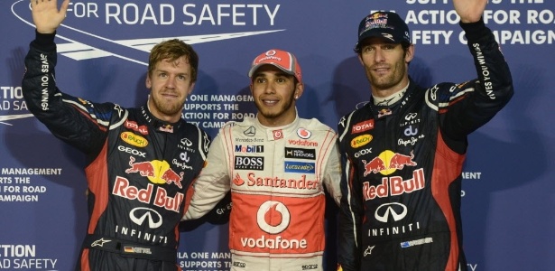 Lewis Hamilton, Mark Webber e Sebastian Vettel: os três primeiros do grid em Abu Dhabi - Dimitar Dilkoff/AFP