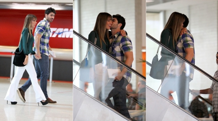 Os ex-BBB's Adriana e Rodrigo circularam nesta quarta-feira por um aeroporto do Rio (14/11/12). O casal trocou carícias