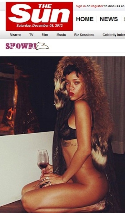 Rihanna aparece usando apenas um sutiã e um casaco de pele enquanto fuma e bebe vinho em uma foto no tabloide "The Sun". A cantora