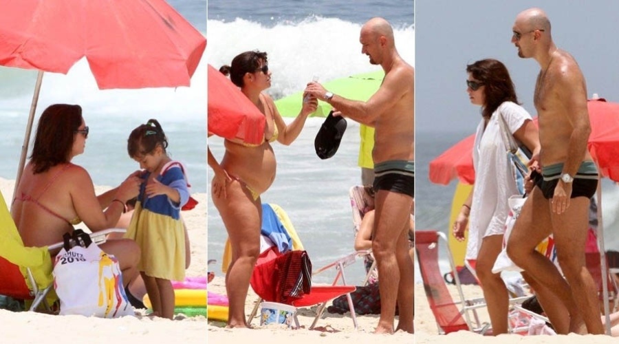 13.dez.2012 - Grávida pela segunda vez, Amandha Lee vai à praia com o marido e a filha