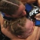 Liz Carmouche tenta pegar Ronda Rousey pelo pescoço durante luta válida pelo UFC 157 - Jeff Gross/Getty Images/AFP