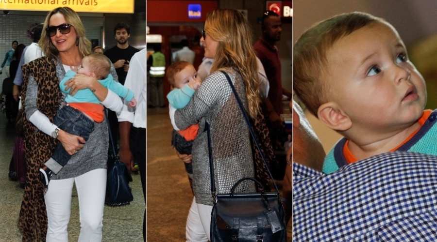 7.mar.2013 - Claudia Leitta desembarcou com a família no aeroporto de Guarulhos, em São Paulos, após viagem aos Estados Unidos. A cantora estava com o filho caçula, Rafael, no colo. Ela é mãe ainda de Davi