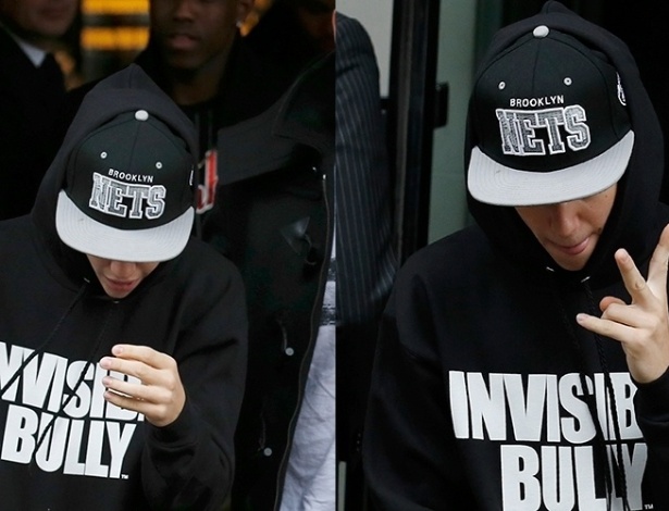 09.mar.2013 - Justin Bieber deixa hotel em Londres fazendo sinal de paz e amor