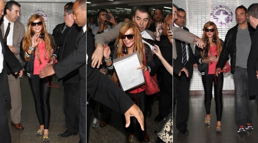 28.mar.2013 - Cercada por seguranças, Lindsay Lohan desembarca no aeroporto internacional de São Paulo. A atriz vai participar da festa de uma grife de roupas. Ela também visitará Florianópolis