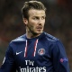 02.abr.2013- David Beckham observa jogo durante duelo entre PSG e Barcelona pelas quartas de final da Liga dos Campeões - AFP PHOTO / KENZO TRIBOUILLARD