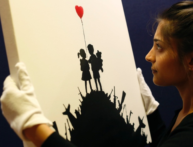 O quadro "Kids On Guns Hill", assinado por Banksy - Olivia Harris/Reuters