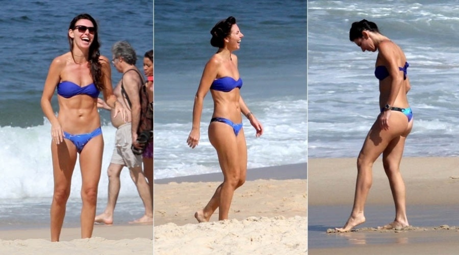 3.mai.2013 - Glenda Kozlowski exibe barriga sarada em praia do Rio
