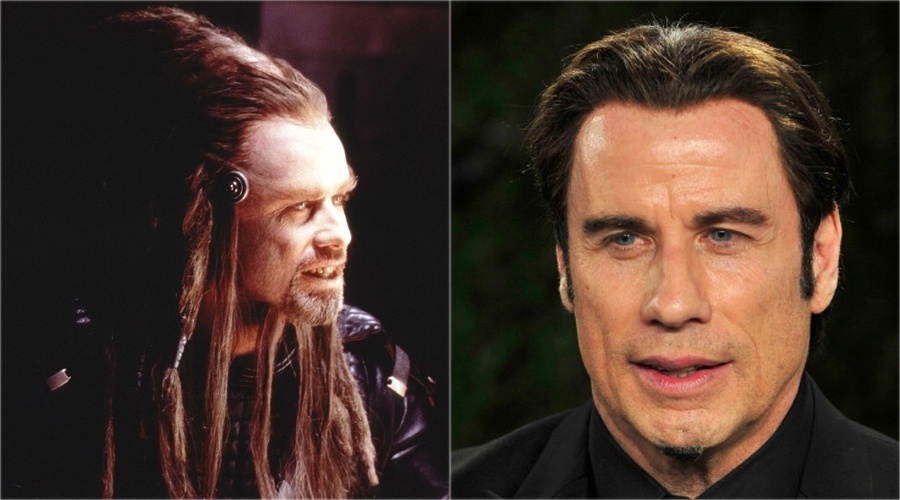 O topetudo ator John Travolta colocou dreads e muita maquiagem para ser um alienígena no filme "A Reconquista", de 2000