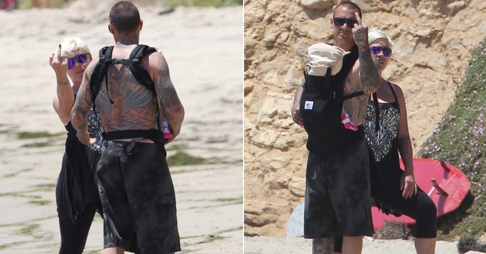 1.jul.2011 - Pink vai à praia com o marido Carey Hart e a filha Willow, se irrita com fotógrafo e resolve mostrar o dedo do meio para o fotógrafo