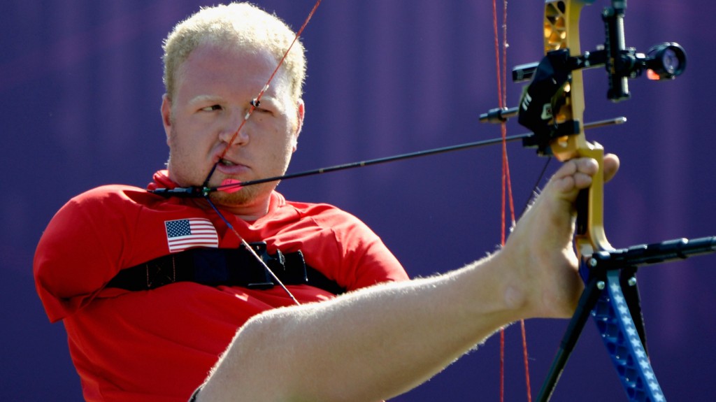 Archer Matt Stutzman of the U.S. prepares to shoot in the London Paralympics. Born without arms, Stutzman uses a release trigger strapped to his shoulder to fire.