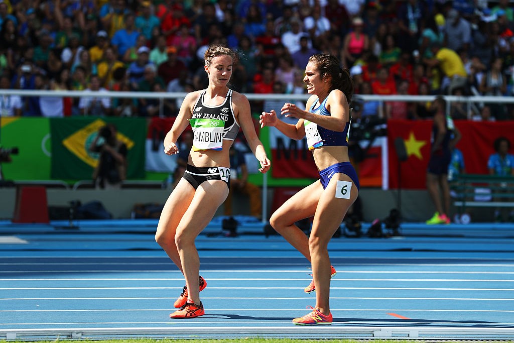 RIO DE JANEIRO, BRAZIL - AUGUST 16: Abbey D'Agostino of the United States (R) and Nikki Hamblin of New Zealand react after a collision during the Women's 5000m Round 1 - Heat 2 on Day 11 of the Rio 2016 Olympic Games at the Olympic Stadium on August 16, 2016 in Rio de Janeiro, Brazil. (Photo by Ian Walton/Getty Images)