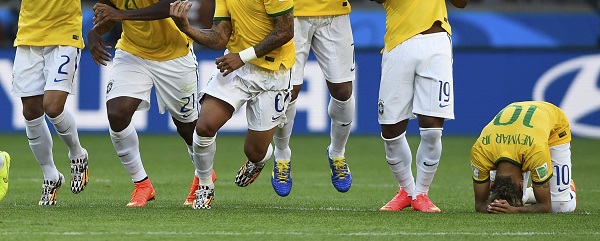 Brazil's national soccer players celebrate their penalty shootout win against Chile in their 2014 World Cup round of 16 game at the Mineirao stadium in Belo Horizonte