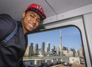 Brazilian Basketball player Bruno Caboclo drafted 20th over all by the Raptors arrives on Porter Airlines from Newark NJ at Billy Bishop Airport in Toronto. Toronto Star reporter Isabel Teotonio (in Red) talks to Bruno as he arrived.