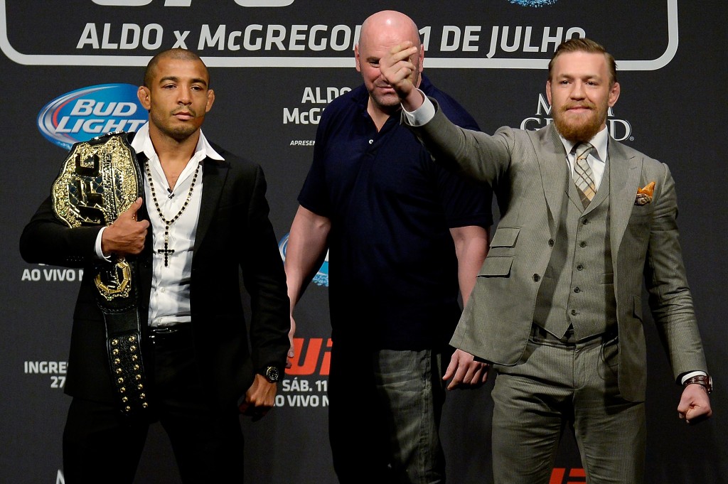 RIO DE JANEIRO, BRAZIL - MARCH 20: UFC featherweight champion Jose Aldo of Brazil (L) and challenger Conor McGregor of Irleland face off as UFC President Dana White (C) stands in during the 189 World Media Tour Launch press conference at Maracanazinho, at Maracanazinho on March 20, 2015 in Rio de Janeiro, Brazil. (Photo by Alexandre Loureiro/Zuffa LLC/Zuffa LLC via Getty Images)