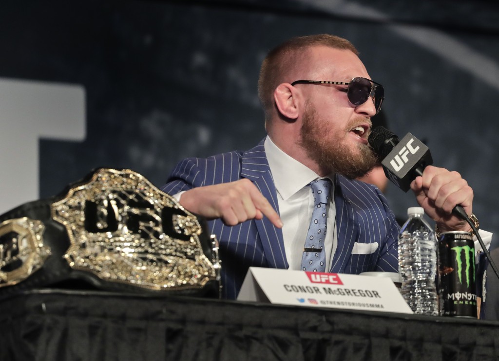 UFC featherweight champion Conor McGregor speaks during a news conference for UFC 205, Tuesday, Sept. 27, 2016, in New York. McGregor will challenge lightweight champion Eddie Alvarez for the lightweight belt on Nov. 12 in what will be the first UFC card to be held in New York after the state legislature legalized the sport earlier this year. (AP Photo/Julie Jacobson) ORG XMIT: NYJJ104