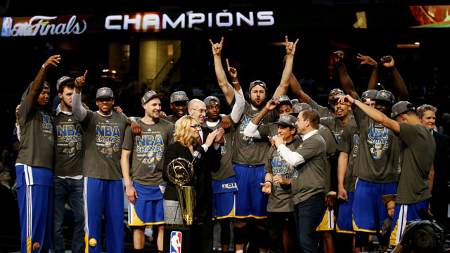 CLEVELAND, OH - JUNE 16: The Golden State Warriors celebrates with the Larry O'Brien NBA Championship Trophy after winning Game Six of the 2015 NBA Finals against the Cleveland Cavaliers at Quicken Loans Arena on June 16, 2015 in Cleveland, Ohio. NOTE TO USER: User expressly acknowledges and agrees that, by downloading and or using this photograph, user is consenting to the terms and conditions of Getty Images License Agreement. (Photo by Ezra Shaw/Getty Images)
