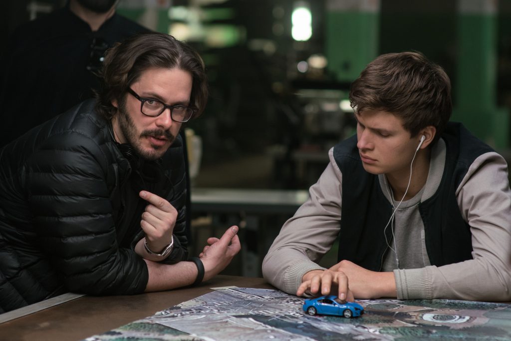 Director Edgar Wright (left) and Ansel Elgort on the set of TriStar Pictures' BABY DRIVER.