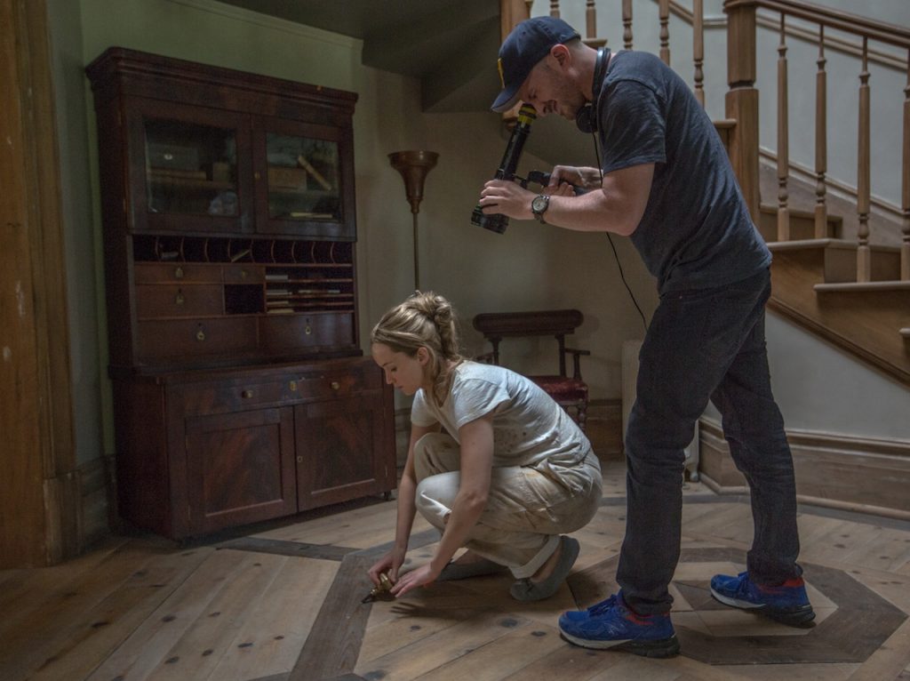 Left to right: Jennifer Lawrence and Director Darren Aronofsky on the set of mother!, from Paramount Pictures and Protozoa Pictures.