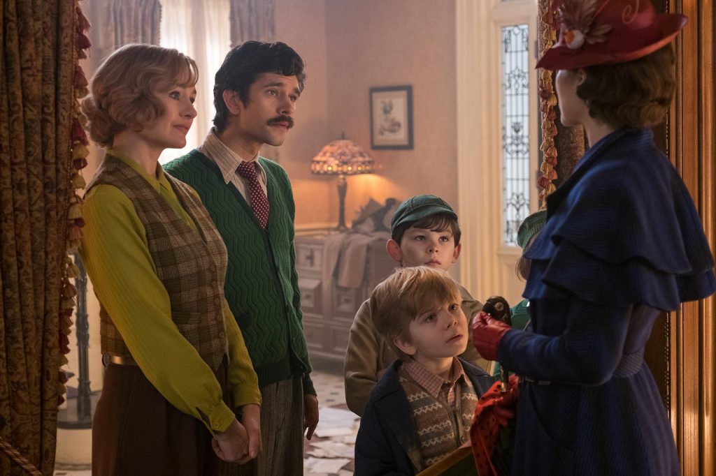Jane (Emily Mortimer), Michael (Ben Whishaw), John (Nathanael Saleh) and Georgie (Joel Dawson) greet Mary Poppins (Emily Blunt) upon her return to the Banks' home in Disney's original musical MARY POPPINS RETURNS, a sequel to the 1964 MARY POPPINS which takes audiences on an entirely new adventure with the practically perfect nanny and the Banks family..