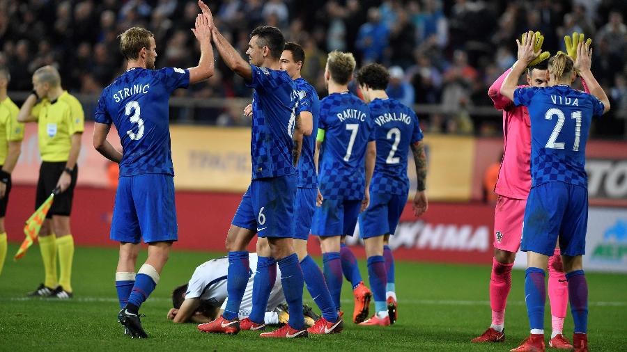 Jogadores da Croácia comemoram classificação à Copa após empate contra a Grécia - Louisa Gouliamaki/AFP