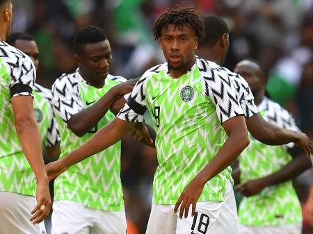 white shirt beige shorts