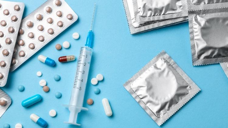 Injeção, comprimidos, preservativo, prevenção HIV - iStock - iStock