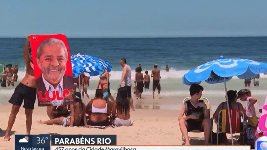 Banhista exibe toalha com rosto de Lula ao vivo na Globo - Globo/Reprodução