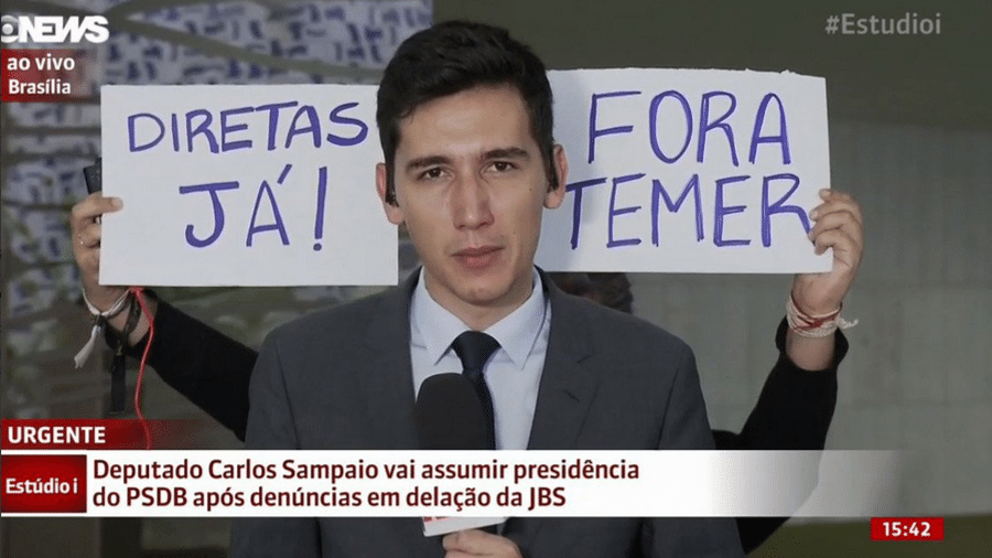 Após cartaz de "Fora Temer", apresentadora pede para deixarem repórter trabalhar - Reprodução/Globo News