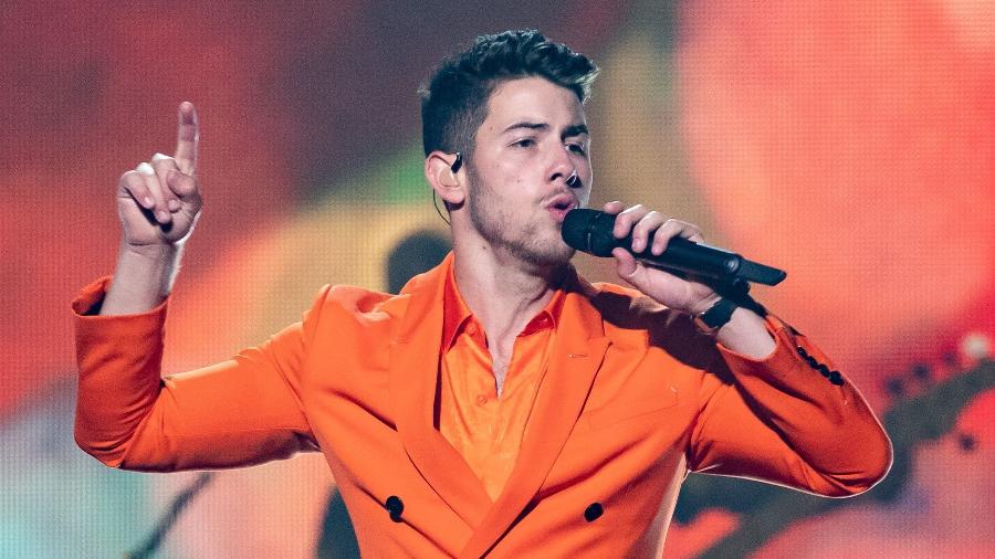 Nick Jonas durante show do Jonas Brothers - SUZANNE CORDEIRO / AFP