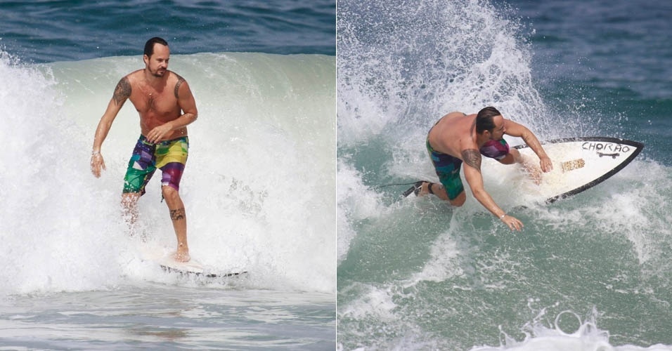 22.jul.2013 - Com bermuda colorida, Paulo Vilhena surfa em praia do Rio