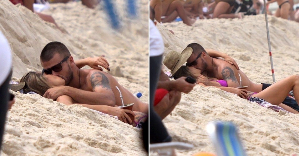 1.set.2013 - Fernanda Lima e Rodrigo Hilbert trocam muitos beijos nas areais da praia do Leblon, no Rio de Janeiro. O casal também se divertiu com os filhos, Francisco e João