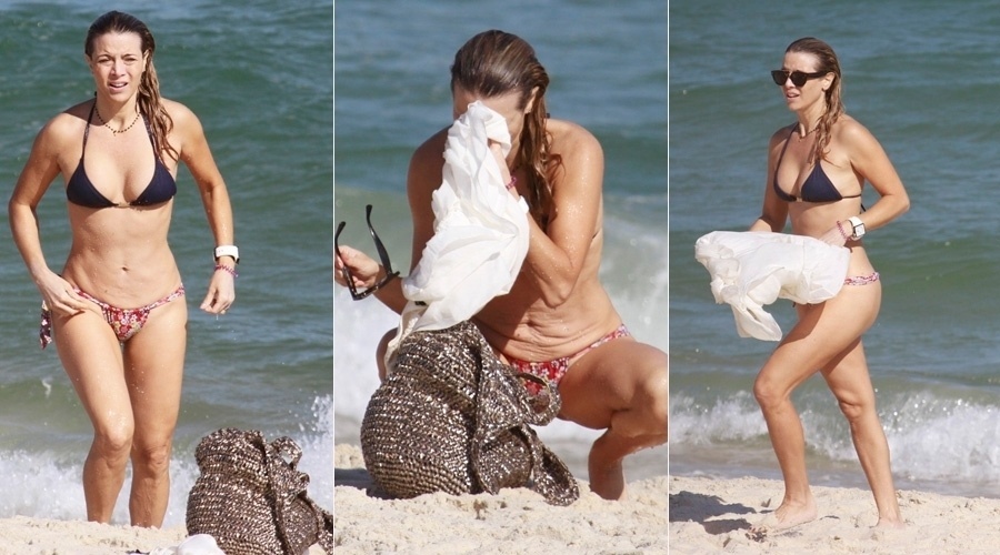 12.set.2013 - Christine Fernandes curtiu praia na Barra da Tijuca, no Rio. A atriz de 45 anos exibiu a boa forma