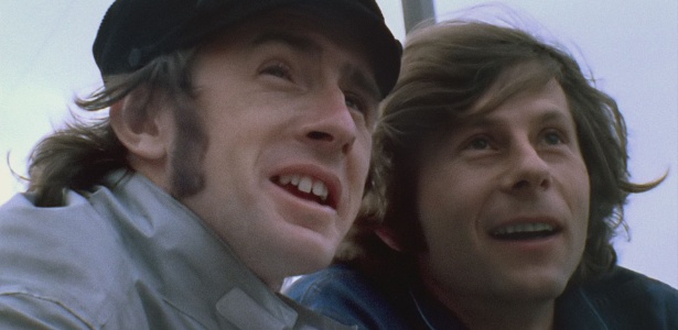 O piloto britânico de Fórmula 1 Jackie Stewart e o cineasta Roman Polanski em cena do documentário "Weekend of a Champion", filmado em 1971 - Divulgação