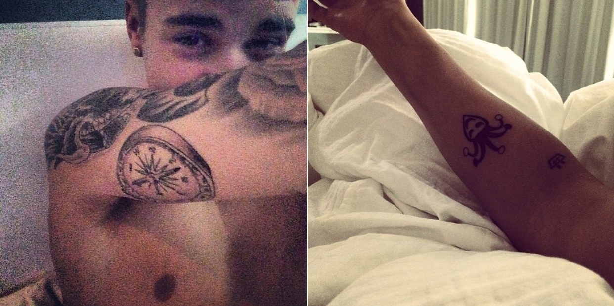 12.jan.2014 - Justin Bieber faz mais duas tatuagens. Neste domingo (12). o cantor canadense compartilhou em seu perfil oficial no Instagram fotos dos dois novos desenhos que fez no braço direito, uma bússola e um coringa. Apesar de ter apenas 19 anos, o ídolo adolescente já possui 22 tatuagens espalhadas pelo corpo