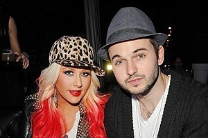 15.fev.2014 - A cantora Christina Aguilera e o namorado Matthew Rutler